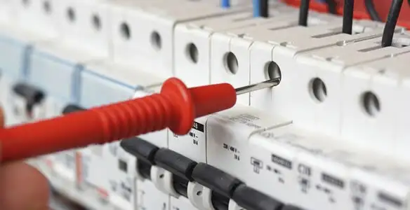 Electrical contractor testing circuit breakers during electrical repair in Riegelsville, PA