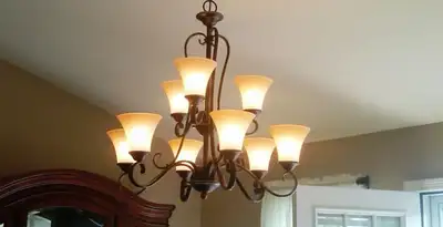 Classic ceiling chandelier installation with warm lighting in Easton, PA