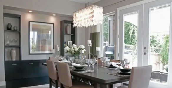 Elegant dining room chandelier installation above table in Easton, PA