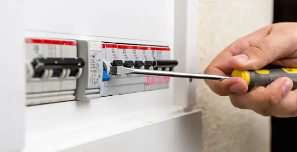 electrical panel upgrade service showing technician adjusting circuit breakers during system upgrade in Easton, PA