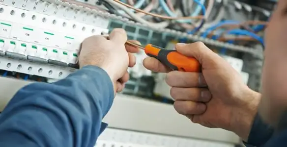 electrical service showing licensed electrician performing electrical panel maintenance and adjustments in Easton, PA