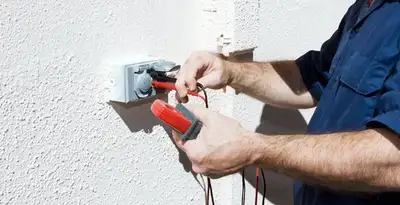 Electrician performing home electrical outlet and wiring inspection in Easton, PA