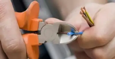 professional electrical services showing precise wire cutting by licensed electricians in Easton, PA