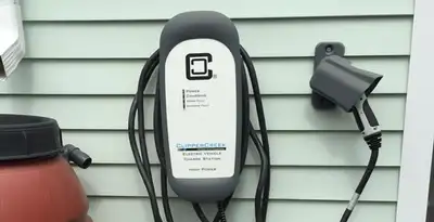 Outdoor electric vehicle charger installation on residential wall in Easton, PA